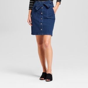 Button up denim skirt with tie in the front.